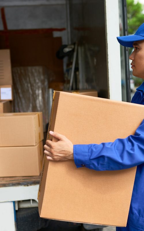 Delivery man loading truck